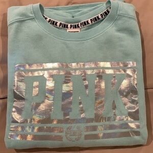Pink Womens oversized mint colored sweatshirt with silver lettering. Size S/P.  